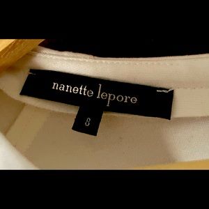 Long-sleeved black and white zip-up dress. Two tone for that slimming effect.